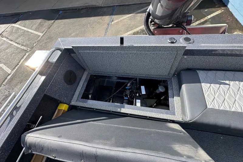 Slide: The Image of Open storage compartment in 2025 Duckworth 20 Advantage SE boat, showing interior details. - 28