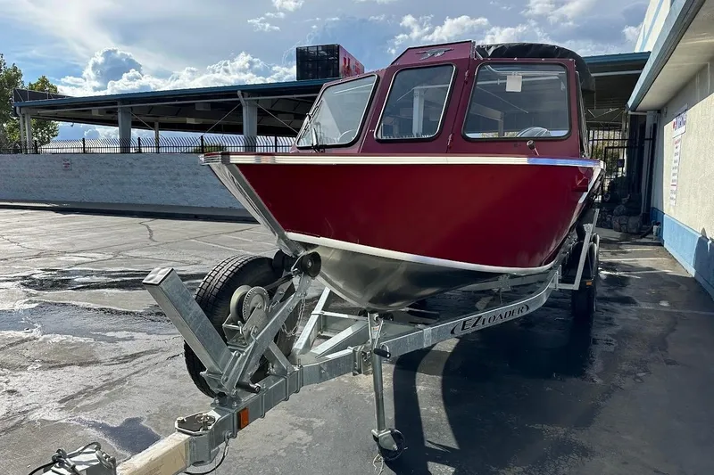 Slide: The Image of 2025 Duckworth 20 Advantage SE boat on trailer, parked outdoors under a cloudy sky. - 3