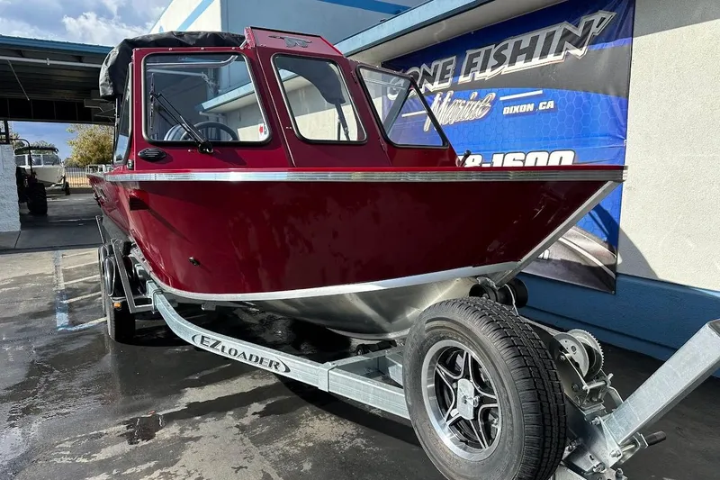 Slide: The Image of 2025 Duckworth 20 Advantage SE boat on trailer, maroon color, parked outdoors. - 5