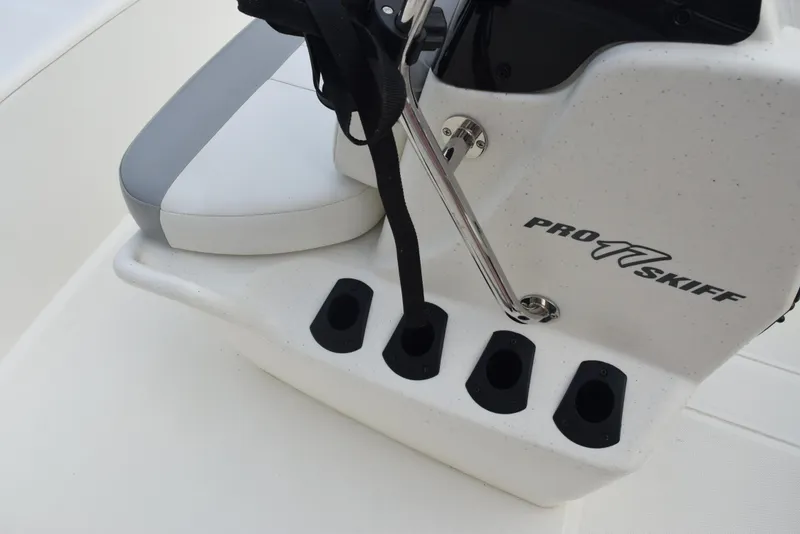 Slide: The Image of 2022 Mako Pro Skiff 17 CC boat console with rod holders and seat. - 17