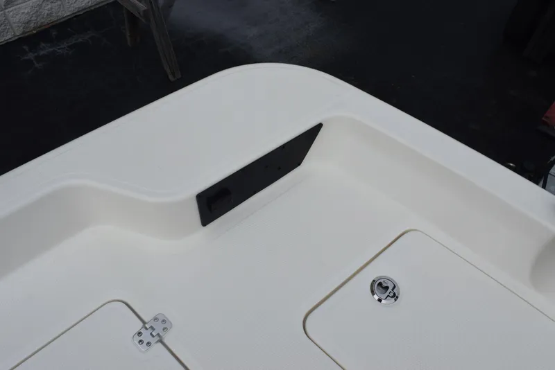 Slide: The Image of 2022 Mako Pro Skiff 17 CC boat deck with storage compartments. - 21