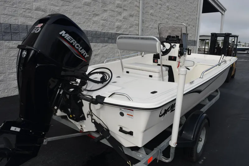 Slide: The Image of 2022 Mako Pro Skiff 17 CC boat with Mercury engine on trailer. - 4