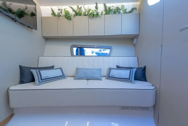 Slide: The Image of Luxurious interior of 2024 Hanover 415 yacht with modern seating and decorative plants. - 10