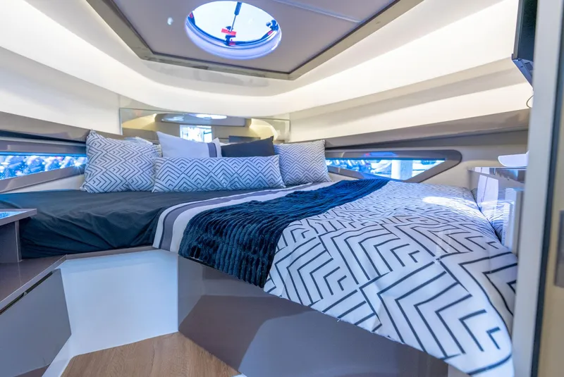 Slide: The Image of Luxurious interior of 2024 Hanover 415 yacht with modern bedding and skylight. - 12