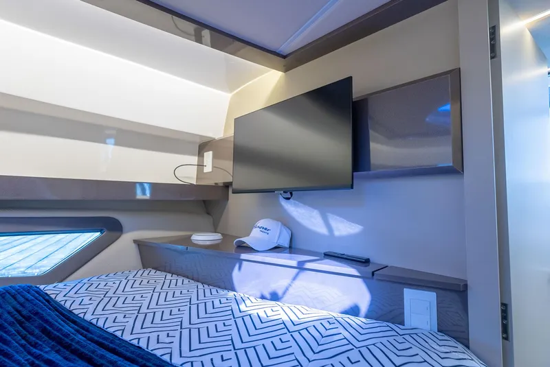 Slide: The Image of Modern bedroom interior in 2024 Hanover 415 yacht with TV and stylish decor. - 14