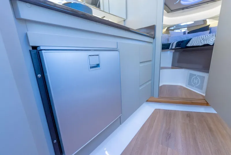 Slide: The Image of Modern interior of Hanover 415 yacht, featuring sleek cabinetry and cozy sleeping area, 2024 model. - 15