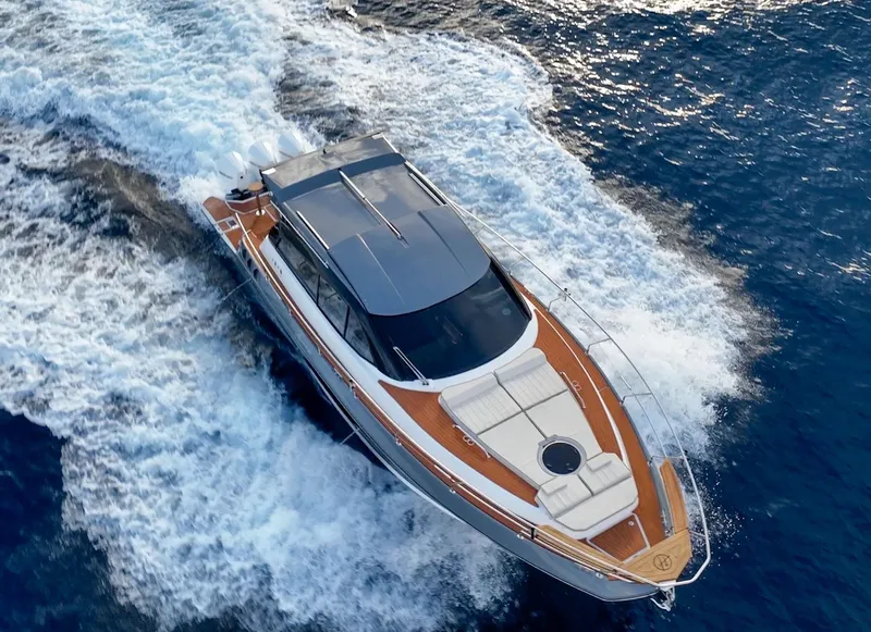 Slide: The Image of 2024 Hanover 415 yacht cruising on open water, aerial view. - 29