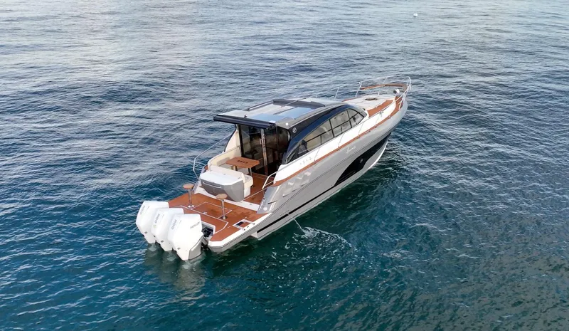 Slide: The Image of 2024 Hanover 415 yacht cruising on open water, showcasing sleek design and powerful engines. - 33