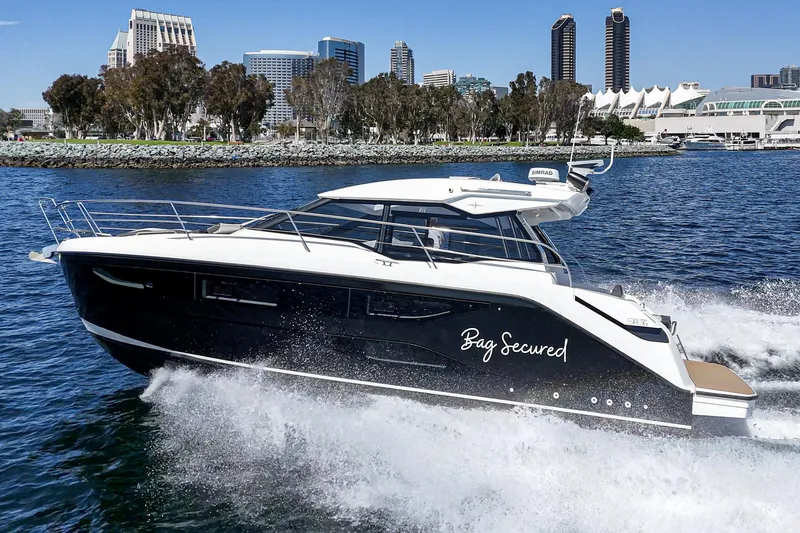 Slide: The Image of 2023 Bavaria SR36 yacht cruising in a city harbor, sleek design, modern architecture backdrop. - 13