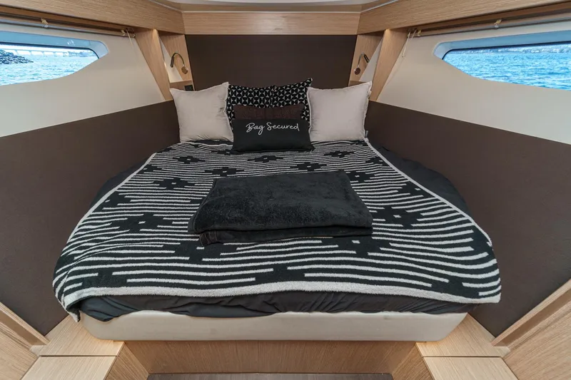 Slide: The Image of Luxurious cabin interior of 2023 Bavaria SR36 yacht with cozy bedding and stylish decor. - 49