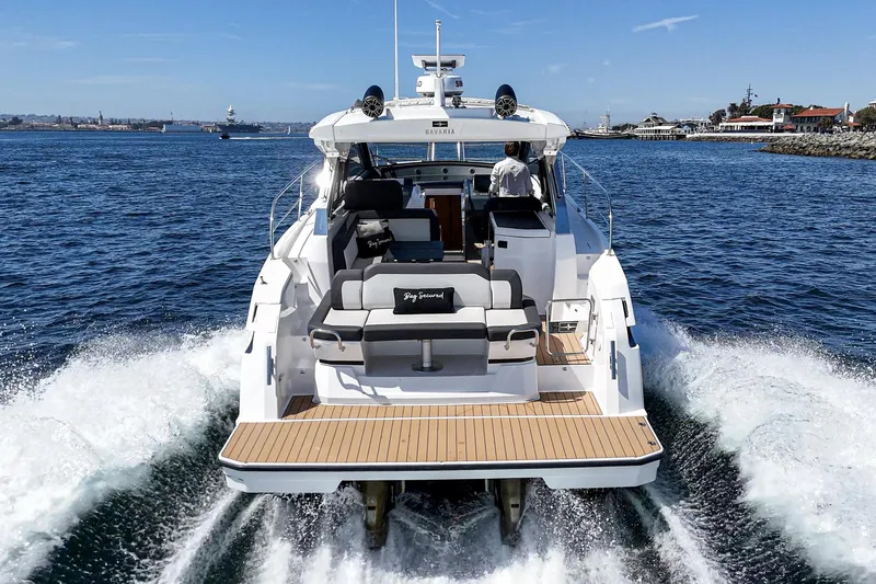 Slide: The Image of 2023 Bavaria SR36 yacht cruising on open water, rear view. - 6