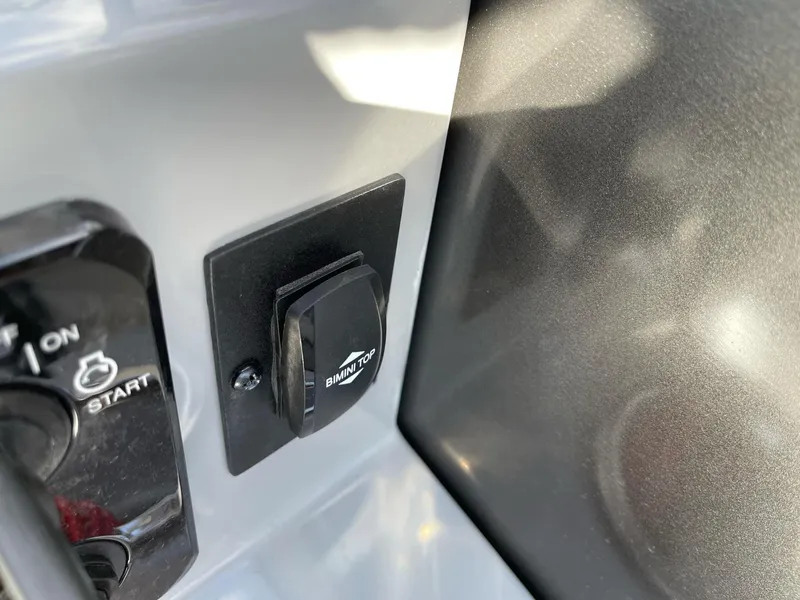 Slide: The Image of 2025 Bentley Pontoons Legacy 243 QSB ignition and control panel close-up. - 10