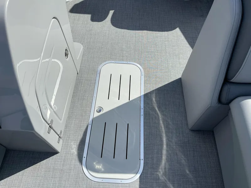 Slide: The Image of 2025 Bentley Pontoons Legacy 243 QSB interior flooring with storage compartment. - 29