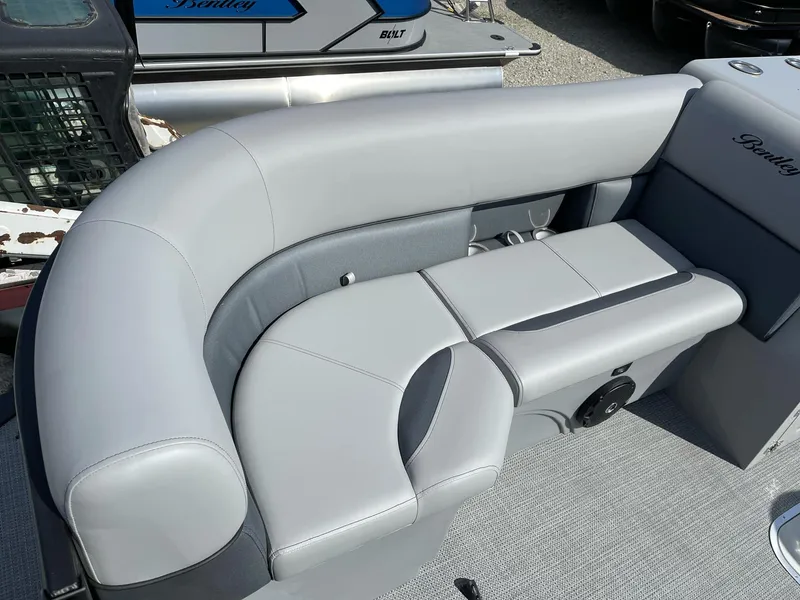 Slide: The Image of 2025 Bentley Pontoons Legacy 243 QSB interior with gray seating and modern design. - 32