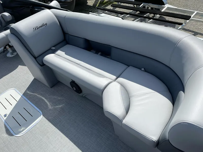 Slide: The Image of 2025 Bentley Pontoons Legacy 243 QSB interior with luxurious gray seating and sleek design. - 33