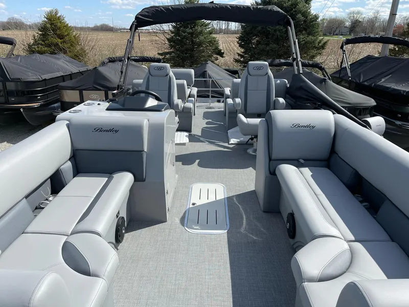 Slide: The Image of 2025 Bentley Pontoons Legacy 243 QSB Dual Captain, spacious seating, luxury design, outdoor setting. - 35