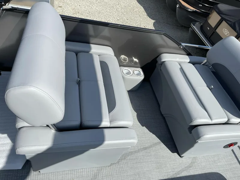 Slide: The Image of 2025 Bentley Pontoons Legacy 243 QSB interior with dual captain seats and cup holders. - 6
