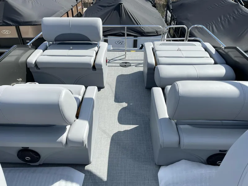 Slide: The Image of 2025 Bentley Pontoons Legacy 243 QSB interior with dual captain seats and luxurious seating. - 9