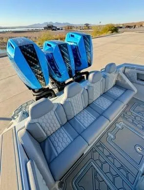Slide: The Image of Luxury boat interior with blue engines, AMP 333 model, 2025, featuring sleek seating and modern design. - 3
