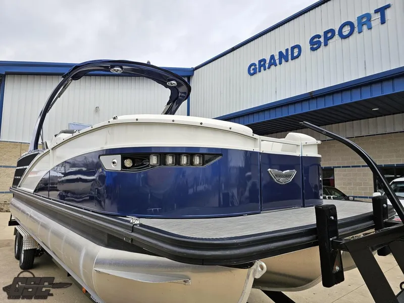 Slide: The Image of 2021 Bennington RX 25 Quad Bench pontoon boat at Grand Sport dealership. - 12
