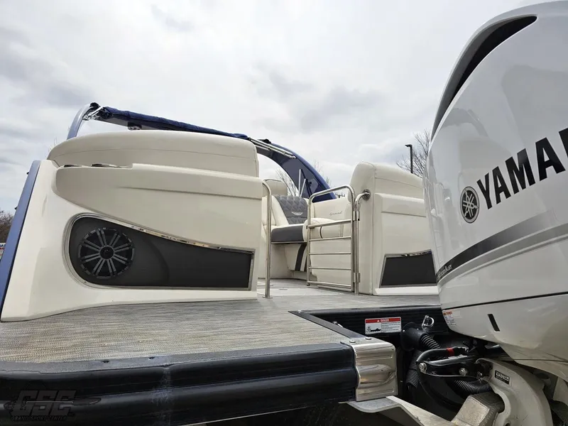 Slide: The Image of 2021 Bennington RX 25 Quad Bench boat with Yamaha engine, featuring spacious seating and modern design. - 27
