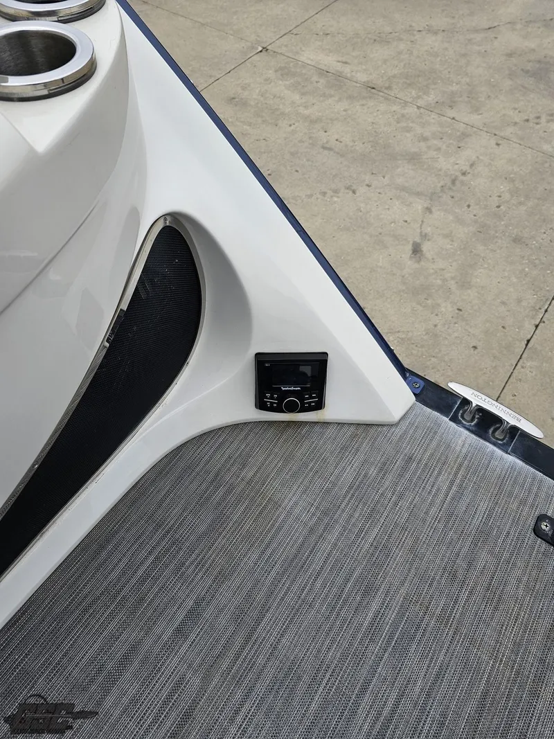 Slide: The Image of 2021 Bennington RX 25 Quad Bench interior with control panel and cup holders. - 32