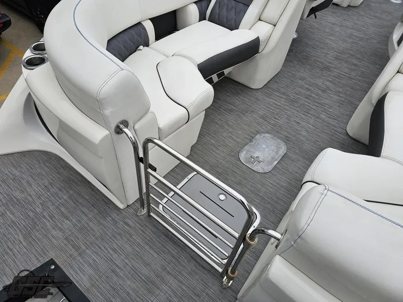 Slide: The Image of 2021 Bennington RX 25 Quad Bench interior with plush seating and sleek flooring. - 33