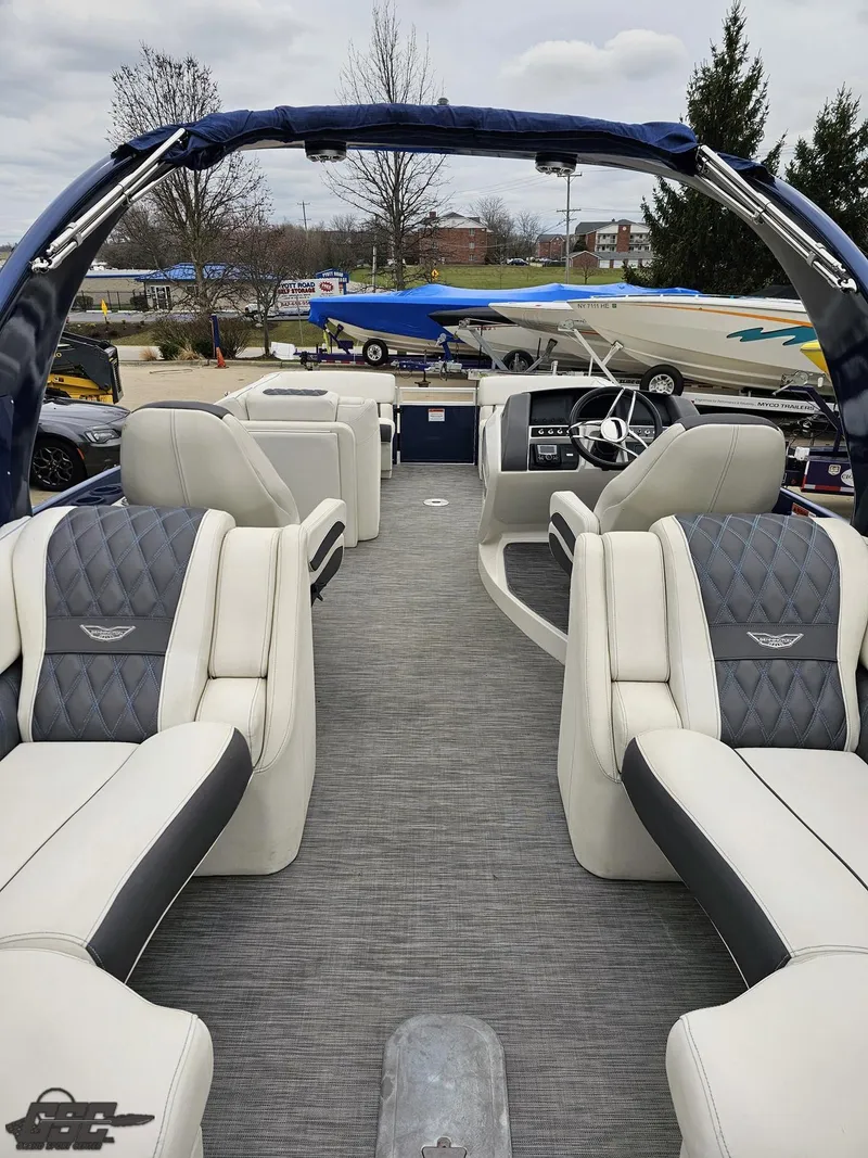 Slide: The Image of 2021 Bennington RX 25 Quad Bench pontoon boat with luxurious seating and modern design. - 38