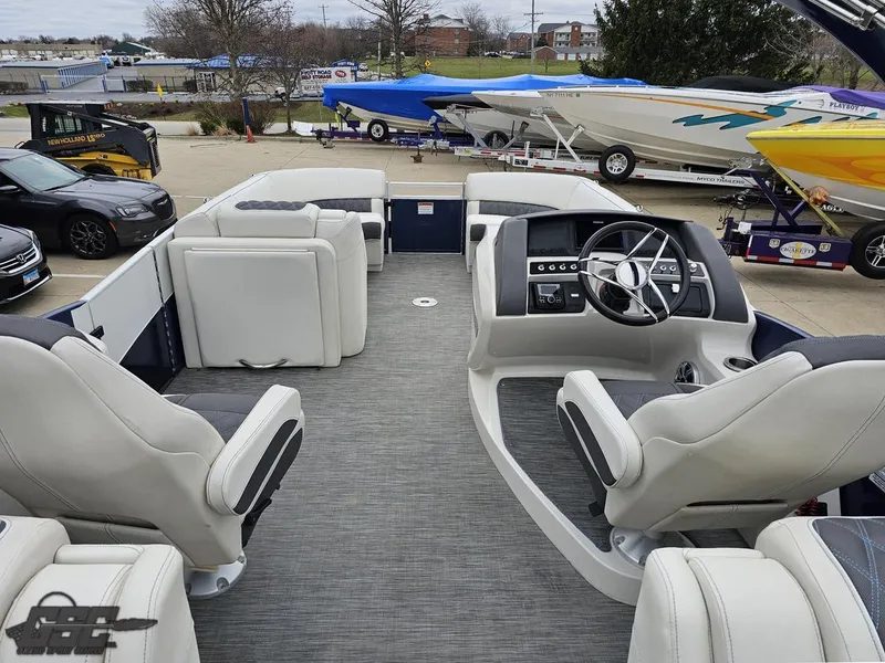 Slide: The Image of 2021 Bennington RX 25 Quad Bench boat interior with modern seating and steering console. - 39