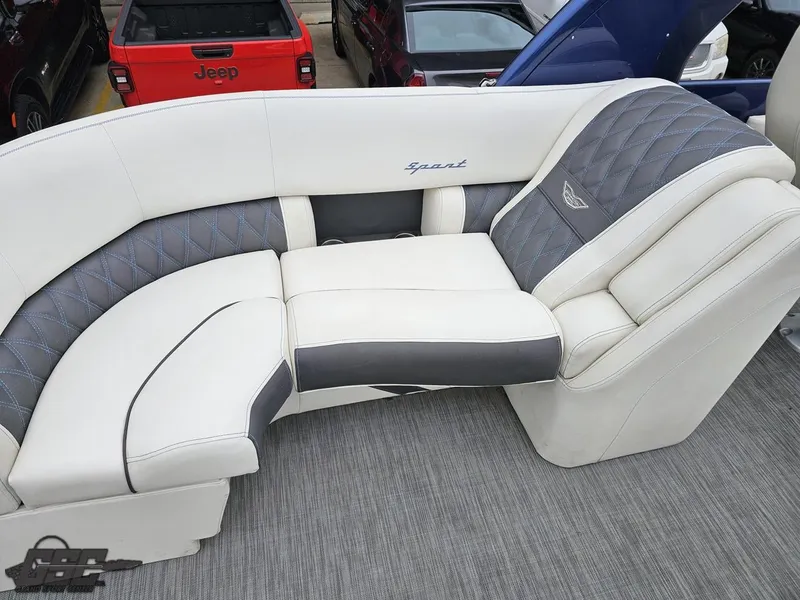 Slide: The Image of 2021 Bennington RX 25 Quad Bench with luxurious white and gray seating. - 40