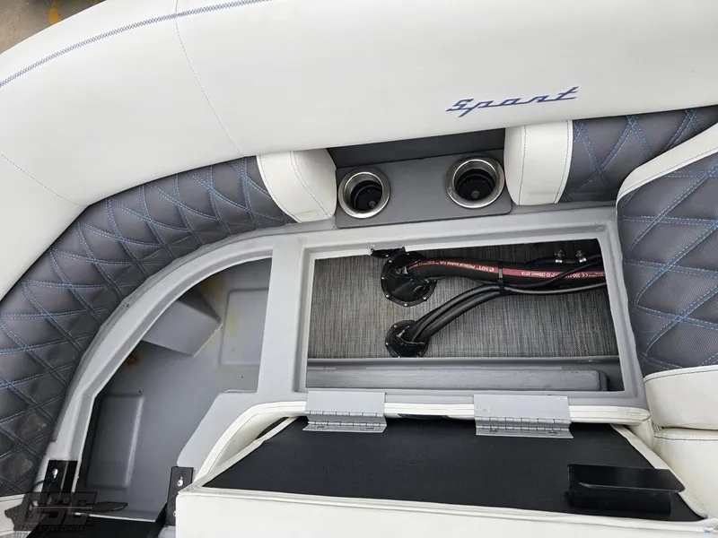 Slide: The Image of 2021 Bennington RX 25 Quad Bench interior with storage compartment and stylish upholstery. - 42