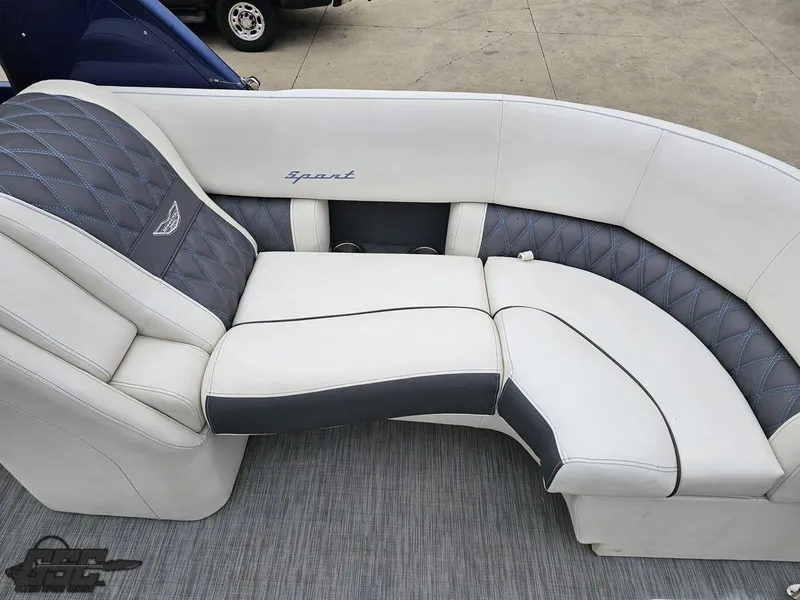 Slide: The Image of Luxurious seating on 2021 Bennington RX 25 Quad Bench boat, featuring elegant white and gray upholstery. - 43