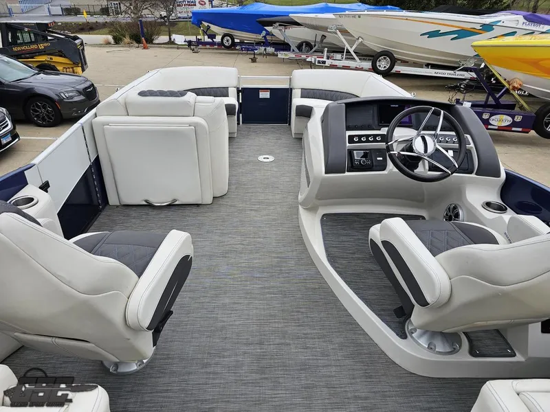 Slide: The Image of 2021 Bennington RX 25 Quad Bench interior with modern seating and steering console. - 47