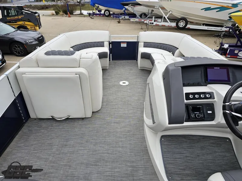 Slide: The Image of 2021 Bennington RX 25 Quad Bench interior with modern seating and control panel. - 48