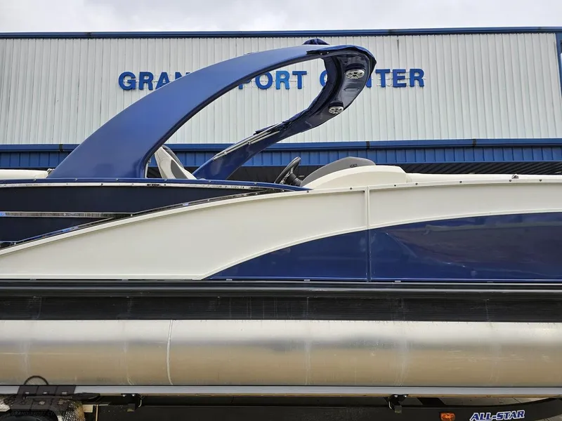 Slide: The Image of 2021 Bennington RX 25 Quad Bench pontoon boat at Grand Sport Center. - 7