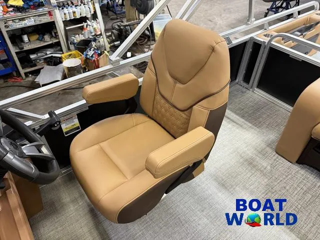Slide: The Image of Luxurious captain's chair in 2025 Tahoe Sport 2385 Swingback Tritoon boat. - 10