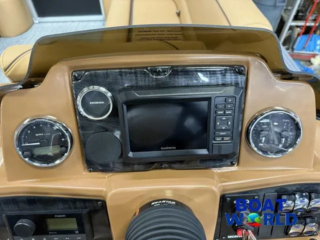 Slide: The Image of Dashboard of 2025 Tahoe Sport 2385 Tritoon with Garmin and Honda instruments. - 13