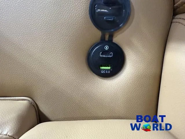 Slide: The Image of USB charging port on Tahoe Sport 2385 Swingback Tritoon, featuring QC 3.0 technology. - 22