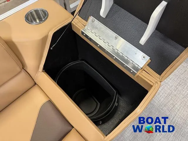 Slide: The Image of Interior storage compartment of 2025 Tahoe Sport 2385 Tritoon boat with cup holder. - 23