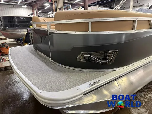 Slide: The Image of 2025 Tahoe Sport 2385 Swingback Tritoon in showroom, featuring sleek design and modern amenities. - 33