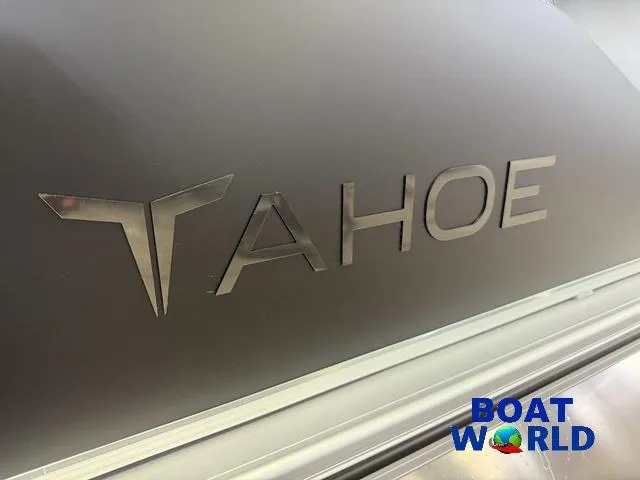 Slide: The Image of 2025 Tahoe Sport 2385 Swingback Tritoon logo with Boat World branding. - 35
