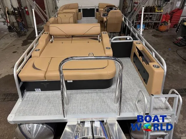 Slide: The Image of 2025 Tahoe Sport 2385 Swingback Tritoon with Honda engine, featuring tan seating and modern design. - 6
