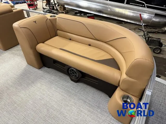 Slide: The Image of 2025 Tahoe Sport 2385 Swingback Tritoon seating with tan upholstery and integrated speaker. - 8