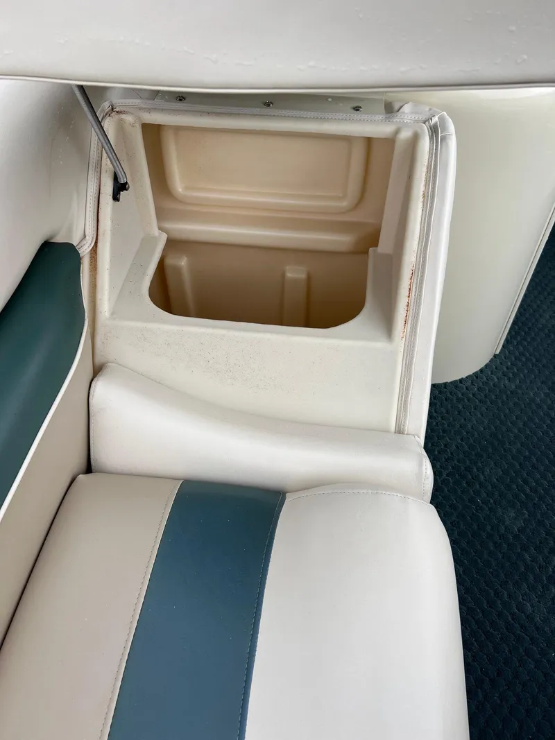 Slide: The Image of Open storage compartment in 2002 Bennington 2575 FS boat seat. - 23