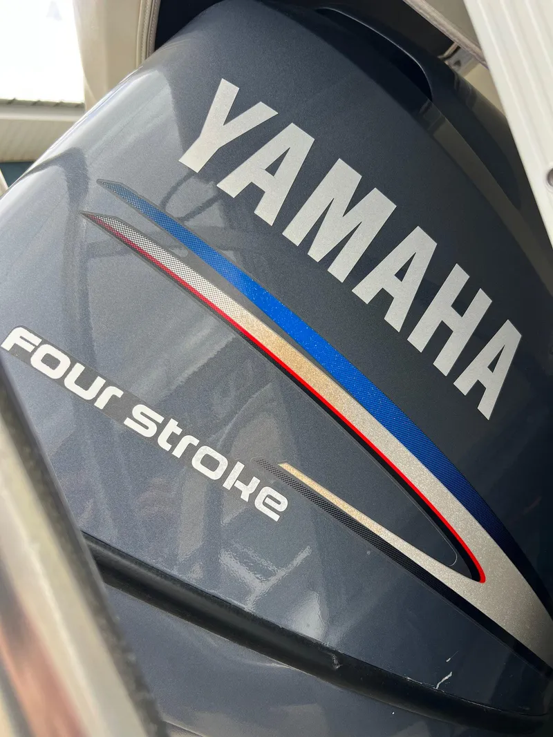 Slide: The Image of Yamaha four-stroke engine on a 2002 Bennington 2575 FS boat. - 3