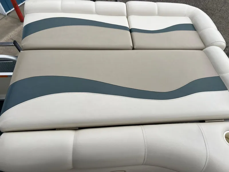 Slide: The Image of 2002 Bennington 2575 FS boat seat with beige and blue wave design upholstery. - 31