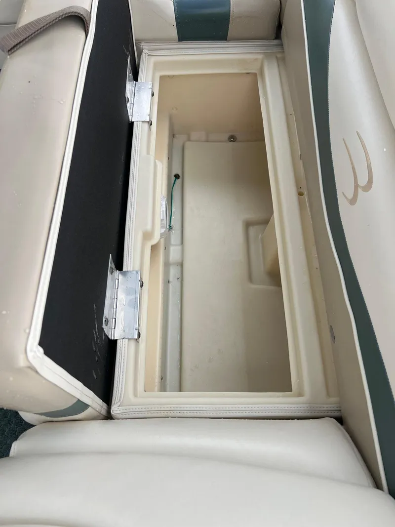 Slide: The Image of Open storage compartment on a 2002 Bennington 2575 FS boat. - 37