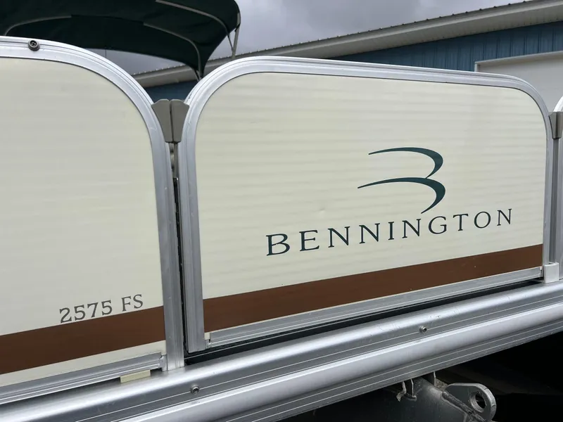 Slide: The Image of 2002 Bennington 2575 FS pontoon boat side view with logo and model details. - 5