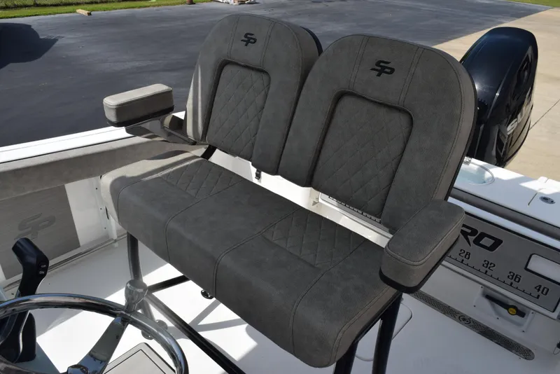 Slide: The Image of 2023 Sea Pro 219 Deep V CC boat seating with gray upholstery and armrests. - 10