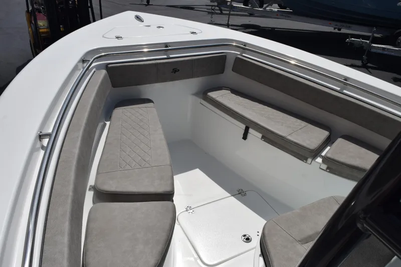 Slide: The Image of 2023 Sea Pro 219 Deep V CC boat interior with cushioned seating and storage. - 12
